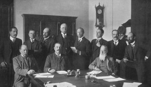 First Union Cabinet. PM Botha sits at table in middle. Public domain image from Wikipedia.